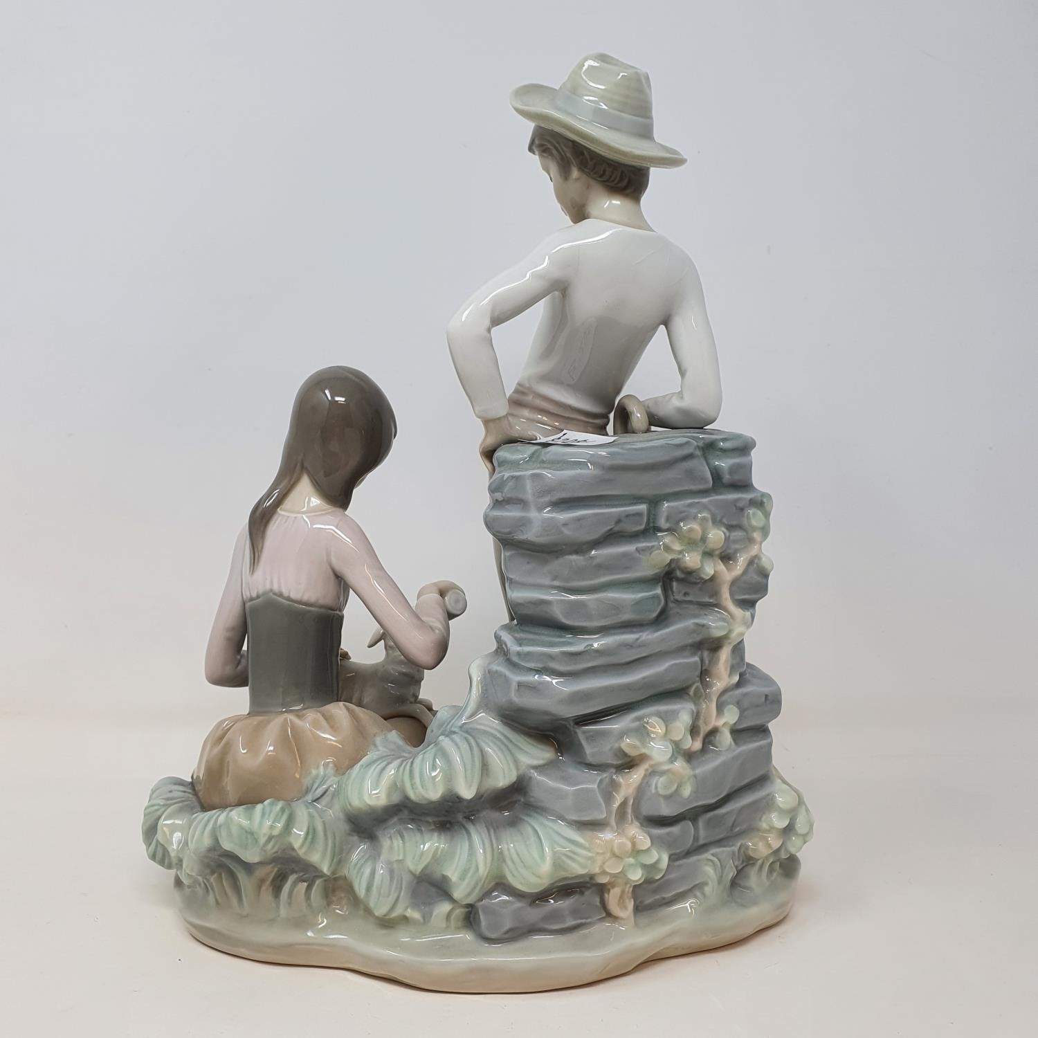 A Lladro group, of a young couple feeding a lamb, 28 cm high No chips cracks or restoration found - Image 2 of 3