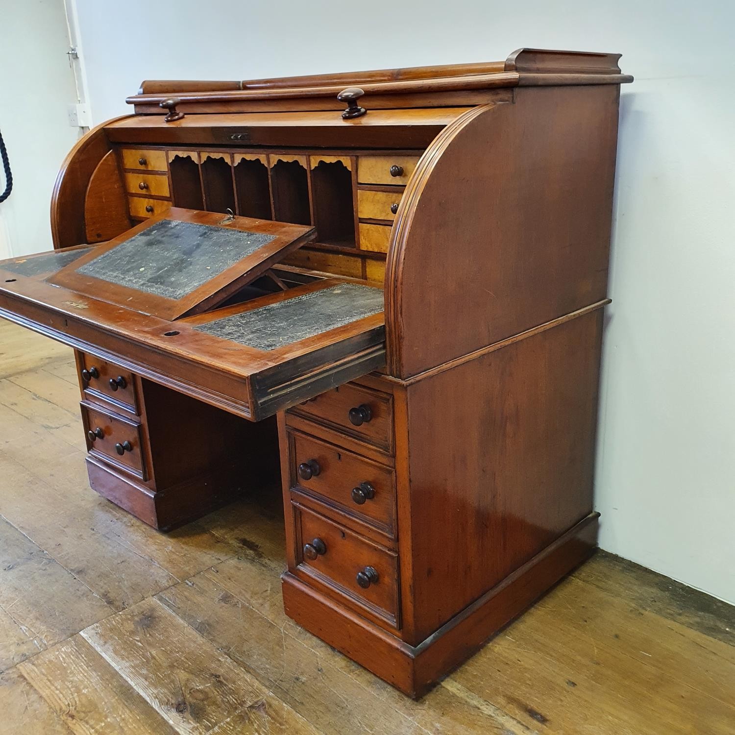 A 19th century mahogany cylinder desk, with a fitted interior, on a base with six drawers, 122 cm - Image 3 of 6
