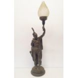A spelter figural lamp, in the form of a Native American, 60 cm high