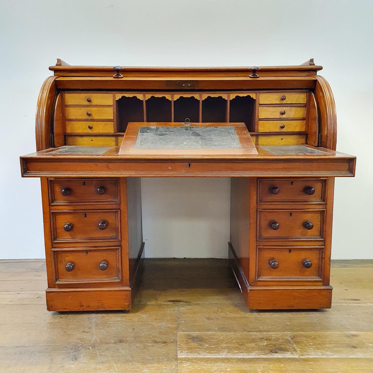 A 19th century mahogany cylinder desk, with a fitted interior, on a base with six drawers, 122 cm - Image 2 of 6
