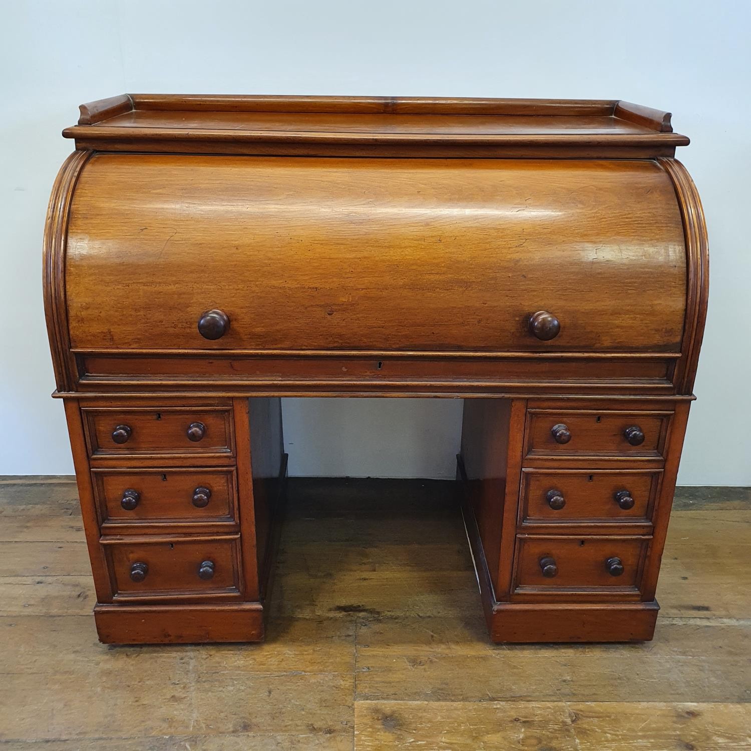 A 19th century mahogany cylinder desk, with a fitted interior, on a base with six drawers, 122 cm - Image 5 of 6