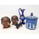 A pair of novelty tobacco jars, in the form of a smoking boy, a Wedgwood vase and cover, and