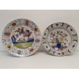 A Delft polychrome plate, 38 cm diameter, and another, 35 cm diameter (2) Smaller one has been split