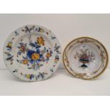 A Delft polychrome plate, 30 cm diameter, and another, 22 cm diameter, both with major losses (2)