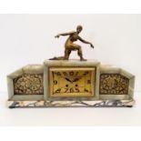 An Art Deco mantel clock, with a finial figure, in a marble case, 62 cm wide Some losses to the