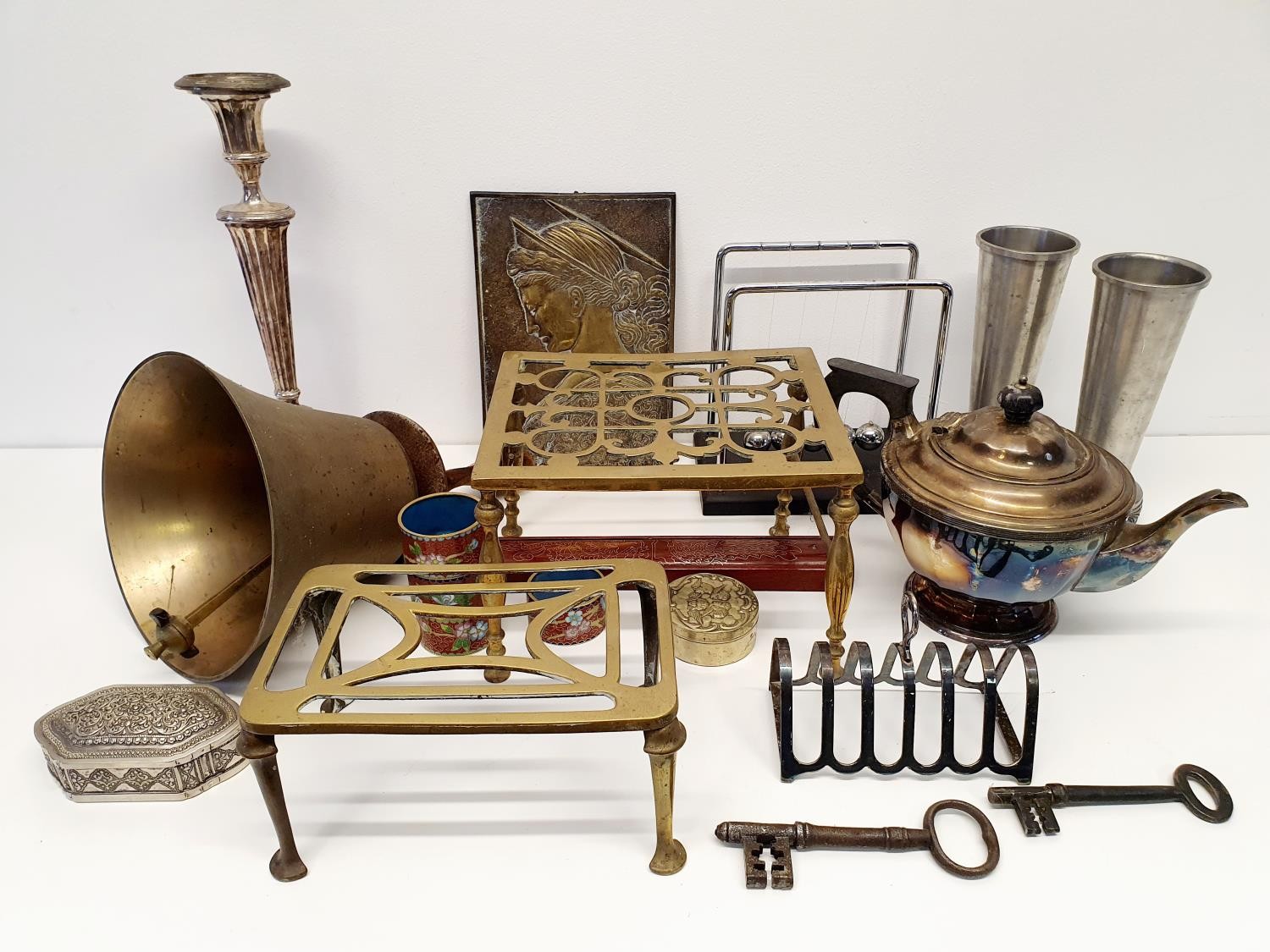 A brass bell, a trivet, a silver plated teapot and assorted metal ware (box)