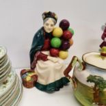 A Royal Doulton figure, The Old Balloon Seller, HN1315, a Wedgwood comical elephant, and other