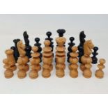 A turned wood chess set, the king being 10 cm high, in a pine box, incomplete Black and white rook