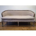 A modern grey sofa, with a limed oak frame, 170 cm wide