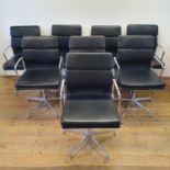 A set of eight office chairs with chrome frames