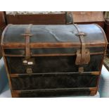 A leather and canvas dome topped trunk, 185 cm wide
