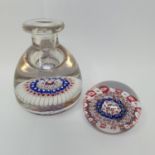 A glass milleflori paperweight, 7 cm diameter, and a similar inkwell, cracked (2)
