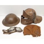 A lobster tail helmet, a WW2 US military helmet, a flying cap and goggles and a straw boater (box)