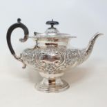 An early Victorian silver teapot, with ebonised handles, Sheffield 1839, 26.2 ozt Provenance: From a