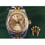 A ladies stainless steel and gold Rolex Oyster Perpetual Datejust wristwatch, with a champagne