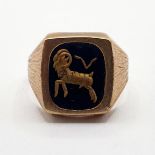 A 9ct gold and onyx set, astrology ring, 6.1 g (all in)
