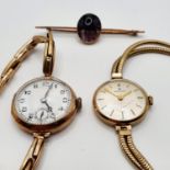 A 9ct gold ladies wristwatch, by Hamilton, another in a yellow metal case, and a bar brooch (3)