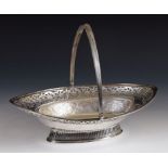 A George III silver swing handled bread basket, with pierced floral decoration, London 1793, 29.54