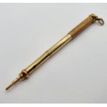 A gilt coloured metal propelling pencil, the top inset with a bloodstone