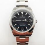 A gentleman's stainless steel Rolex Explorer, having a black dial, with guarantee card (2010), extra