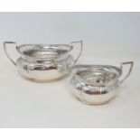 An Edward VII silver oval sugar bowl, and a matching cream jug, Birmingham 1907, 10.6 ozt