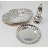 A George V silver dish, a pin tray, and a pepperpot, various dates and marks, 4.7 ozt (3)