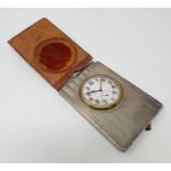 A silver mounted travelling clock, in a leather mounted case, Birmingham 1919, leather hinge very