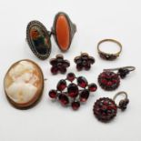 A pair of 19th century earrings, set with red stone, another pair of earrings, two rings, and