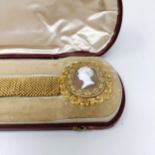 An early 19th century yellow coloured metal and cameo memoriam bracelet, the reverse engraved