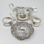 A Victorian silver sifter spoon, London 1874, a pickle fork, a pierced heart shaped bowl, and a