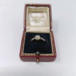 An 18ct gold and solitaire diamond ring, ring H 1/2, and a vintage ring box (2)