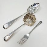 A George IV silver spoon, later embossed with berries, a sifter spoon and a pickle fork, various