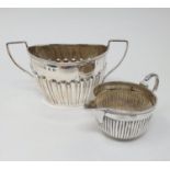 A Victorian silver sugar bowl, Birmingham 1895, and a Victorian silver cream jug, Birmingham 1881,