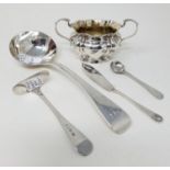 A Victorian silver Old English pattern sauce ladle, London 1865, a salt and spoon, a baby's push and