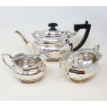 A George V silver three piece tea set, the tea pot with ebonised handles, Birmingham, 1927, 30.6