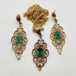 A 9ct gold and green stone pendant, on a chain, and matching earrings (3)