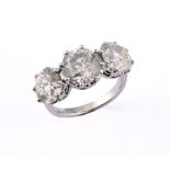 A large and impressive 18ct white gold and three stone diamond ring, approx. 7.1ct, ring size M 1/2