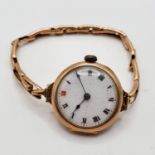 A ladies 9ct gold wristwatch, monogrammed and dated 1919, on an expanding bracelet 20.7 g all in