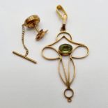 A yellow metal and green stone Art Nouveau style pendant, and a tie-pin (2)