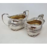 An Edward VII silver sugar bowl, and a matching cream jug, Chester 1902, 15.8 ozt (2)Provenance: