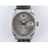 A gentleman's stainless steel Rolex Oyster Perpetual Datejust wristwatch, having a silvered dial,