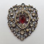 A paste set and silver coloured metal heart shaped pendant, 5 cm high