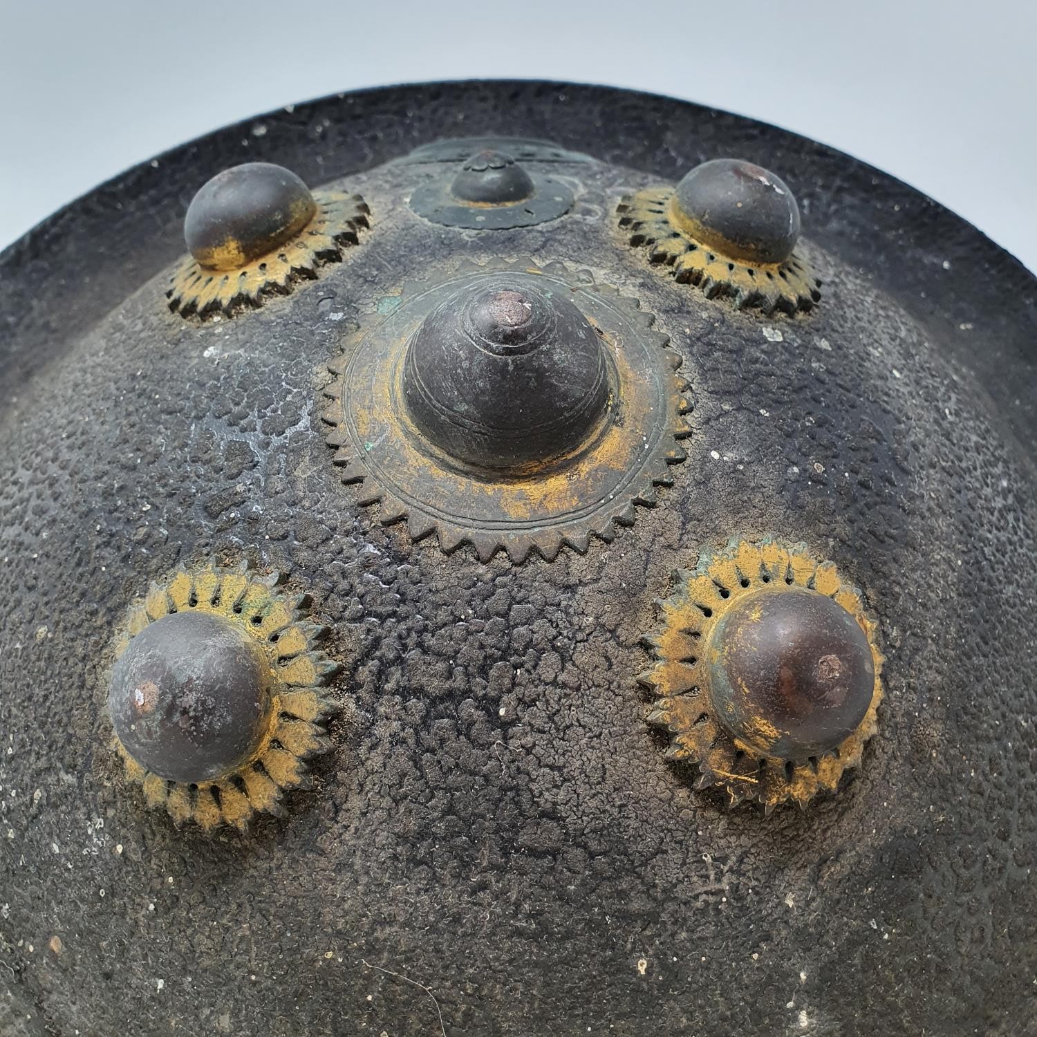 An Indian hide shield or dhal shield, with gilt metal mounts, probably 19th century, 47 cm - Image 3 of 4