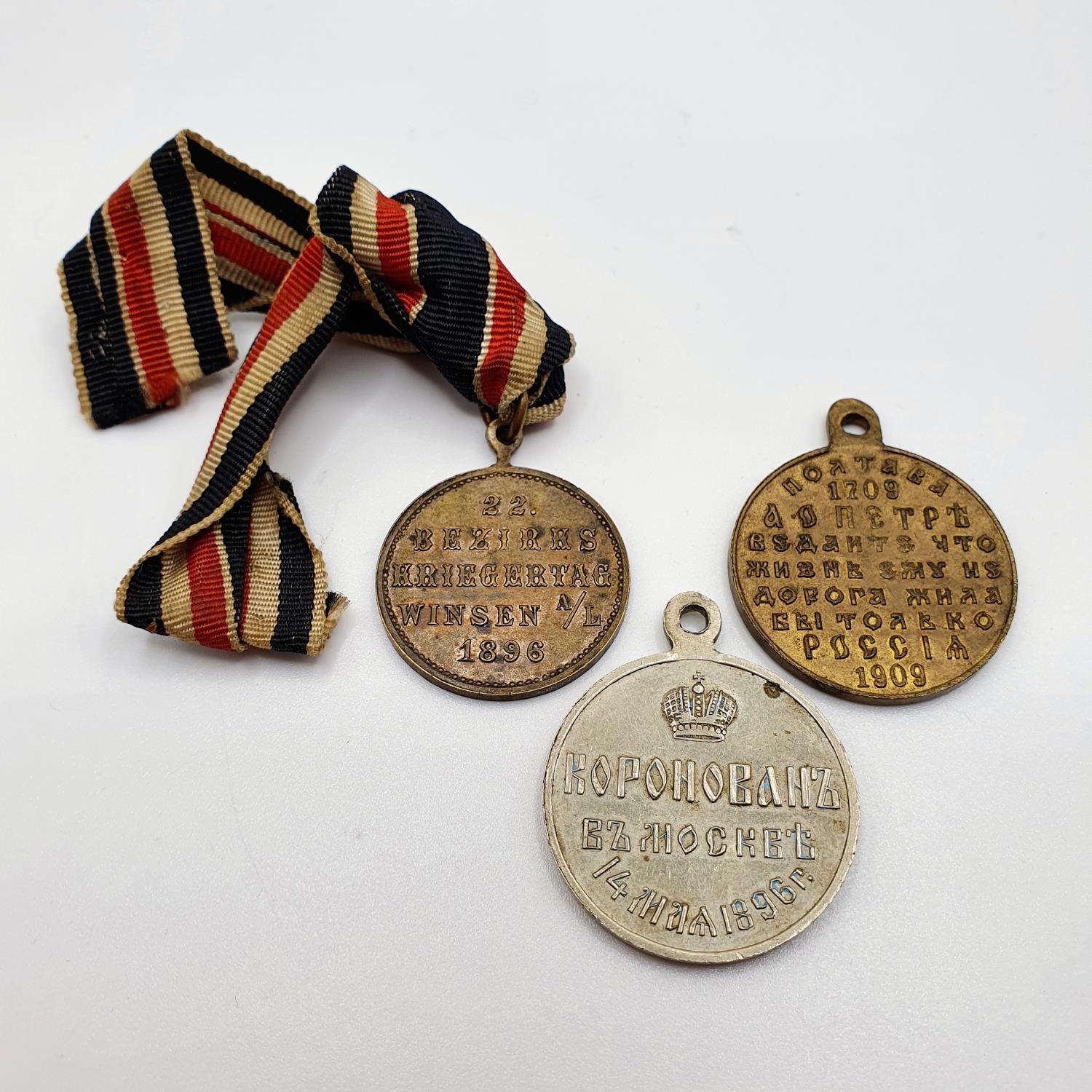 A Russian medallion, a German medallion, and another medallion (3) Provenance: From a collection