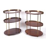 An unusual pair of mahogany and brass campaign oval washstands, having three tiers, 85 cm high x