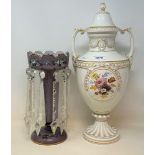A Meissen porcelain vase and cover, painted a panel of flowers, and with gilt decoration, cover