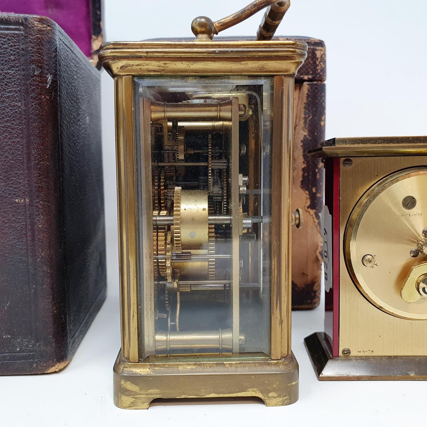 A carriage clock, the 5.5 cm wide enamel dial with Roman numerals, and a subsidiary alarm dial, in a - Image 3 of 5