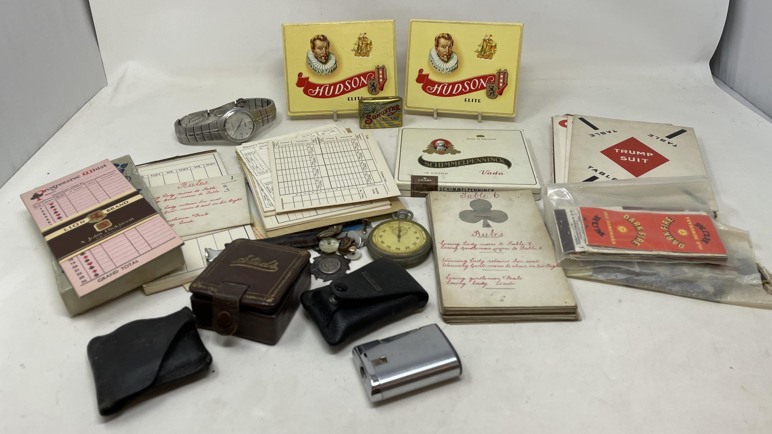 A silver plated pocket watch, assorted cufflinks, three packs of cigars, and assorted ephemera (box)