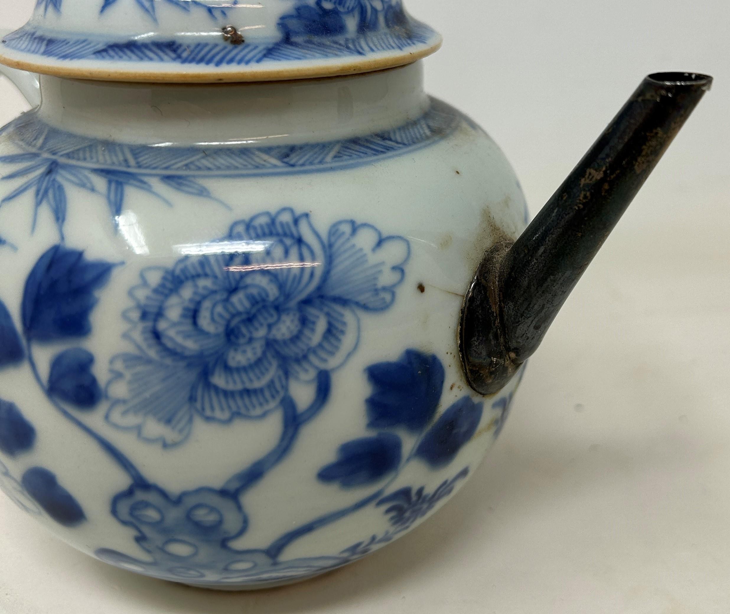 A Chinese porcelain teapot and cover, with floral decoration in underglaze blue, 13.5 cm high - Image 2 of 3