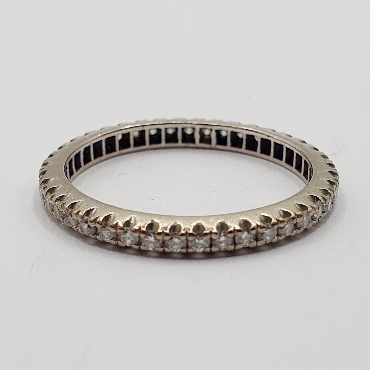 An 18ct gold and diamond eternity ring, ring size K 2.2 g all in